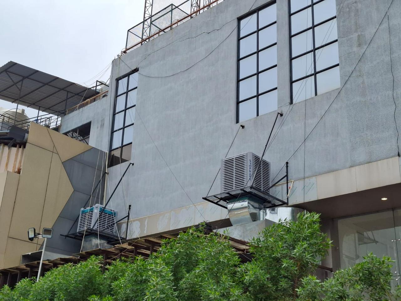 Wall-mounted ducted air coolers serving a commercial building.